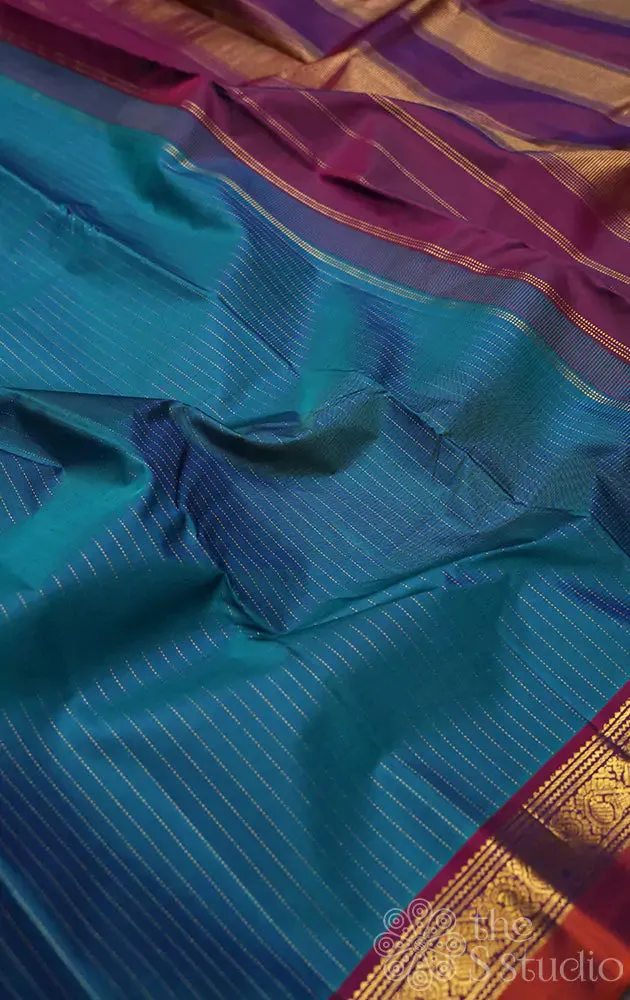Rama blue kanchi silk saree with vertical thread lines and purple pallu